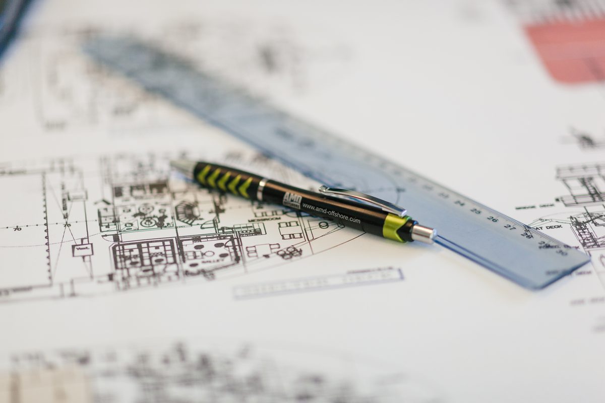 Deck plans with ruler and pen during project preparation